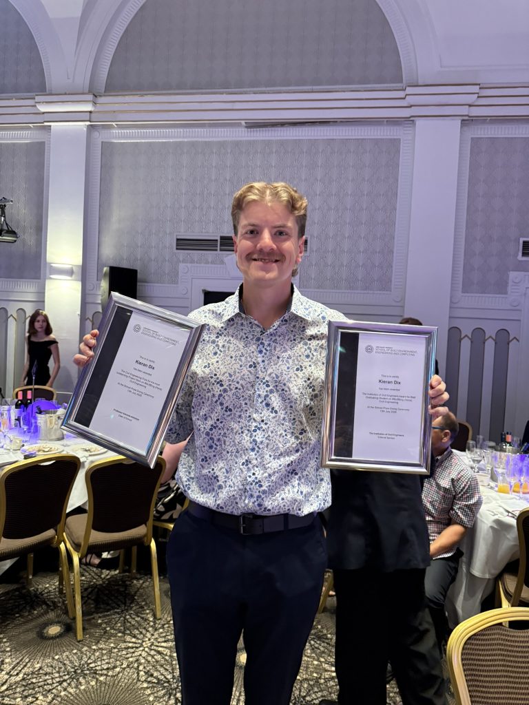 Kieran being given his awards after graduation